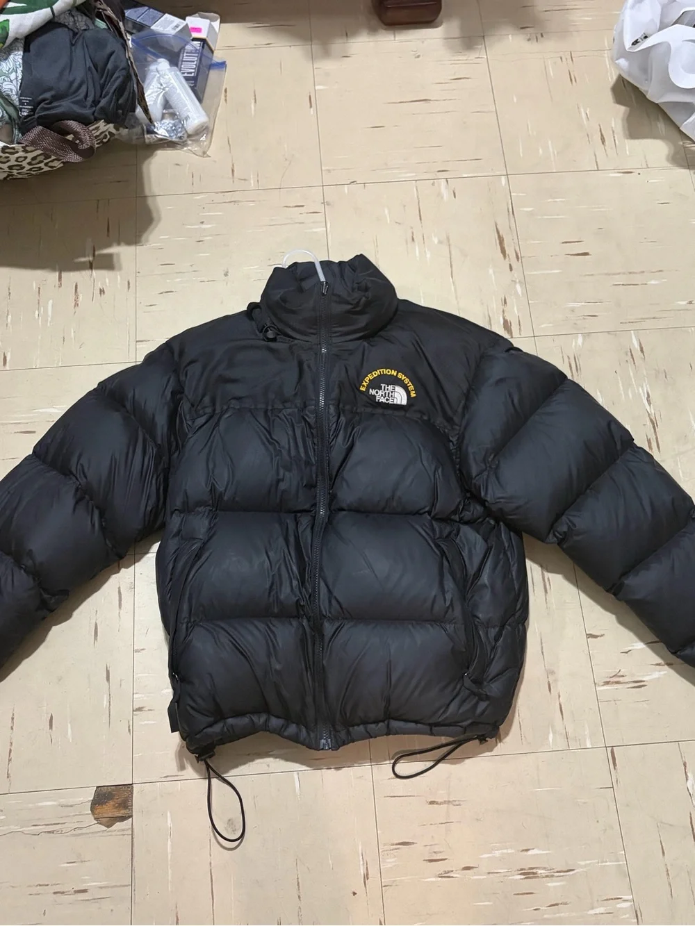 The North Face Black Puffer Jacket with Yellow Logo